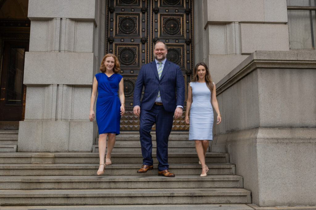 Andrew Saller, Hannah Ernstberger, & Lillian McElroy walking down steps